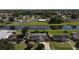 Aerial view capturing a cozy home with a canal in the backyard providing serene water views at 624 Royal Palm Dr, Kissimmee, FL 34743