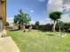 Spacious backyard with lush lawn, mature trees, and fenced perimeter at 624 Royal Palm Dr, Kissimmee, FL 34743