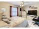 Comfortable bedroom features white tile flooring, ceiling fan, and neutral color scheme, creating a relaxing space at 624 Royal Palm Dr, Kissimmee, FL 34743