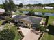 Aerial view of the home showing mature landscaping, and a brick paver driveway at 624 Royal Palm Dr, Kissimmee, FL 34743