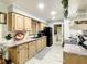 Well-lit kitchen with wood cabinets and modern appliances at 624 Royal Palm Dr, Kissimmee, FL 34743