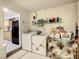 Functional laundry room with washer, dryer, and storage shelving at 624 Royal Palm Dr, Kissimmee, FL 34743