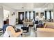 Cozy living room featuring hardwood floors, white walls, and comfortable seating at 624 Royal Palm Dr, Kissimmee, FL 34743