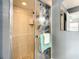Tiled shower stall with a glass door and a pebble floor at 624 Royal Palm Dr, Kissimmee, FL 34743