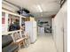 Spacious storage room with shelving, a spare fridge, and extra storage space at 624 Royal Palm Dr, Kissimmee, FL 34743