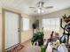 Enclosed sunroom with white door, windows with blinds, and potted plants, providing a relaxing and functional transitional space at 624 Royal Palm Dr, Kissimmee, FL 34743