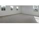 Bright and airy bedroom with plush carpeting and several windows at 630 Summit River Dr, Apopka, FL 32712