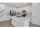 Modern kitchen with white cabinets, stainless steel appliances, and a central island at 630 Summit River Dr, Apopka, FL 32712