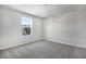 This bedroom features neutral walls, carpet, and a window providing ample natural light at 640 Summit River Dr, Apopka, FL 32712