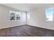 Bright room with neutral walls, beautiful wood-look tile floors, and multiple windows providing ample natural light at 640 Summit River Dr, Apopka, FL 32712