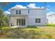Backyard with green lawn and spacious covered patio at 645 Summit River Dr, Apopka, FL 32712
