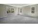 Bright bedroom with three large windows and plush carpeting at 645 Summit River Dr, Apopka, FL 32712
