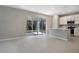 Open-concept kitchen with breakfast bar and sliding glass doors leading to the outdoors at 645 Summit River Dr, Apopka, FL 32712