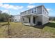 Spacious backyard with a covered patio, perfect for outdoor relaxation and entertainment at 655 Summit River Dr, Apopka, FL 32712