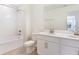 Charming bathroom boasting a shower-tub combo, tile flooring, and a modern vanity at 655 Summit River Dr, Apopka, FL 32712
