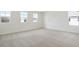 Spacious, sunlit bedroom with plush carpeting and large windows, creating a cozy retreat at 655 Summit River Dr, Apopka, FL 32712