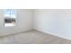 Well-lit bedroom featuring plush carpeting, a large window, and neutral paint at 655 Summit River Dr, Apopka, FL 32712