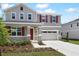 Charming home with beautiful landscaping, featuring stone accents and a two-car garage at 655 Summit River Dr, Apopka, FL 32712