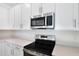 Close-up of a modern kitchen with stainless steel appliances and sleek countertops at 655 Summit River Dr, Apopka, FL 32712