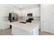 Bright kitchen with white cabinets, stainless steel appliances, and an island, perfect for cooking at 655 Summit River Dr, Apopka, FL 32712