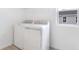 Convenient laundry room with modern washer and dryer units, plus ample space at 655 Summit River Dr, Apopka, FL 32712