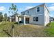 A spacious backyard with a covered patio and lawn at 660 Summit River Dr, Apopka, FL 32712