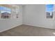 Bright bedroom with neutral carpet, two large windows offering plenty of natural light, and fresh neutral paint at 660 Summit River Dr, Apopka, FL 32712