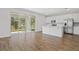Open-concept kitchen features white cabinets, stainless steel appliances, and a seamless transition to the outdoors at 660 Summit River Dr, Apopka, FL 32712