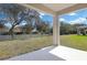 A covered patio overlooking the backyard at 665 Summit River Dr, Apopka, FL 32712