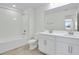 Bright bathroom featuring a double sink vanity, tub, and toilet at 665 Summit River Dr, Apopka, FL 32712