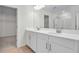 Bright bathroom featuring a double sink vanity with quartz countertops and modern finishes at 665 Summit River Dr, Apopka, FL 32712