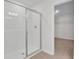 Bathroom with a tiled walk-in shower and an open doorway to a closet at 665 Summit River Dr, Apopka, FL 32712