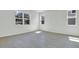Bright, empty bedroom with tile flooring and ample natural light from multiple windows offers a clean, inviting space at 665 Summit River Dr, Apopka, FL 32712