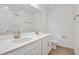 Modern bathroom featuring double sinks, white cabinets, and a shower with a glass door at 675 Summit River Dr, Apopka, FL 32712