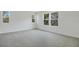 Spacious bedroom featuring multiple windows bringing in an abundance of natural light at 675 Summit River Dr, Apopka, FL 32712