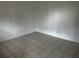 Empty bedroom featuring tiled flooring, painted walls, and electrical outlets at 731 Michigan Ct # 1, St Cloud, FL 34769