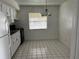 Kitchen and dining area featuring tiled flooring, appliances, and natural light at 731 Michigan Ct # 1, St Cloud, FL 34769