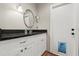 Bathroom featuring a modern vanity, sink with black countertop, and a convenient doggie door at 736 Forest Glen Ct, Maitland, FL 32751