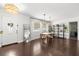 Bright dining area with modern lighting, and dark wood floors perfect for entertaining at 736 Forest Glen Ct, Maitland, FL 32751