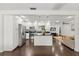 Modern kitchen with white cabinets, a black countertop island, and stainless steel appliances at 736 Forest Glen Ct, Maitland, FL 32751
