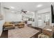 Spacious living room with a comfortable sofa, leading to a well-lit kitchen and dining area at 736 Forest Glen Ct, Maitland, FL 32751