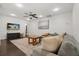 Comfortable living room with a large sectional sofa, ceiling fan, and modern decor at 736 Forest Glen Ct, Maitland, FL 32751