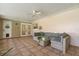 Inviting screened patio with comfortable seating, potted plants, ceiling fan, offering relaxation at 736 Forest Glen Ct, Maitland, FL 32751