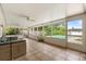 Expansive screened patio boasting view of a sparkling pool, ceiling fans, with tiled floors and ample seating at 736 Forest Glen Ct, Maitland, FL 32751