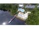 Enjoy the view of the lake with the community's pool, tiki bar, volleyball court, and pier at 1106 Gran Bahama Blvd # 1106, Davenport, FL 33897