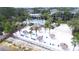Aerial view of the community's white sand beach, volleyball court, pool, and tiki huts at 1106 Gran Bahama Blvd # 1106, Davenport, FL 33897