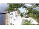 Capture the essence of relaxation with an aerial view of the pool, sandy beach, and lakeside amenities at 1106 Gran Bahama Blvd # 1106, Davenport, FL 33897