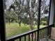 The screened-in porch offers views of mature trees and greenery, creating a serene outdoor space at 1106 Gran Bahama Blvd # 1106, Davenport, FL 33897