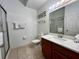 Clean bathroom featuring a glass shower door, wood vanity, and large mirror at 1106 Gran Bahama Blvd # 1106, Davenport, FL 33897