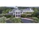 Exterior of the clubhouse shows its inviting entrance, balconies, and lush landscaping at 1106 Gran Bahama Blvd # 1106, Davenport, FL 33897
